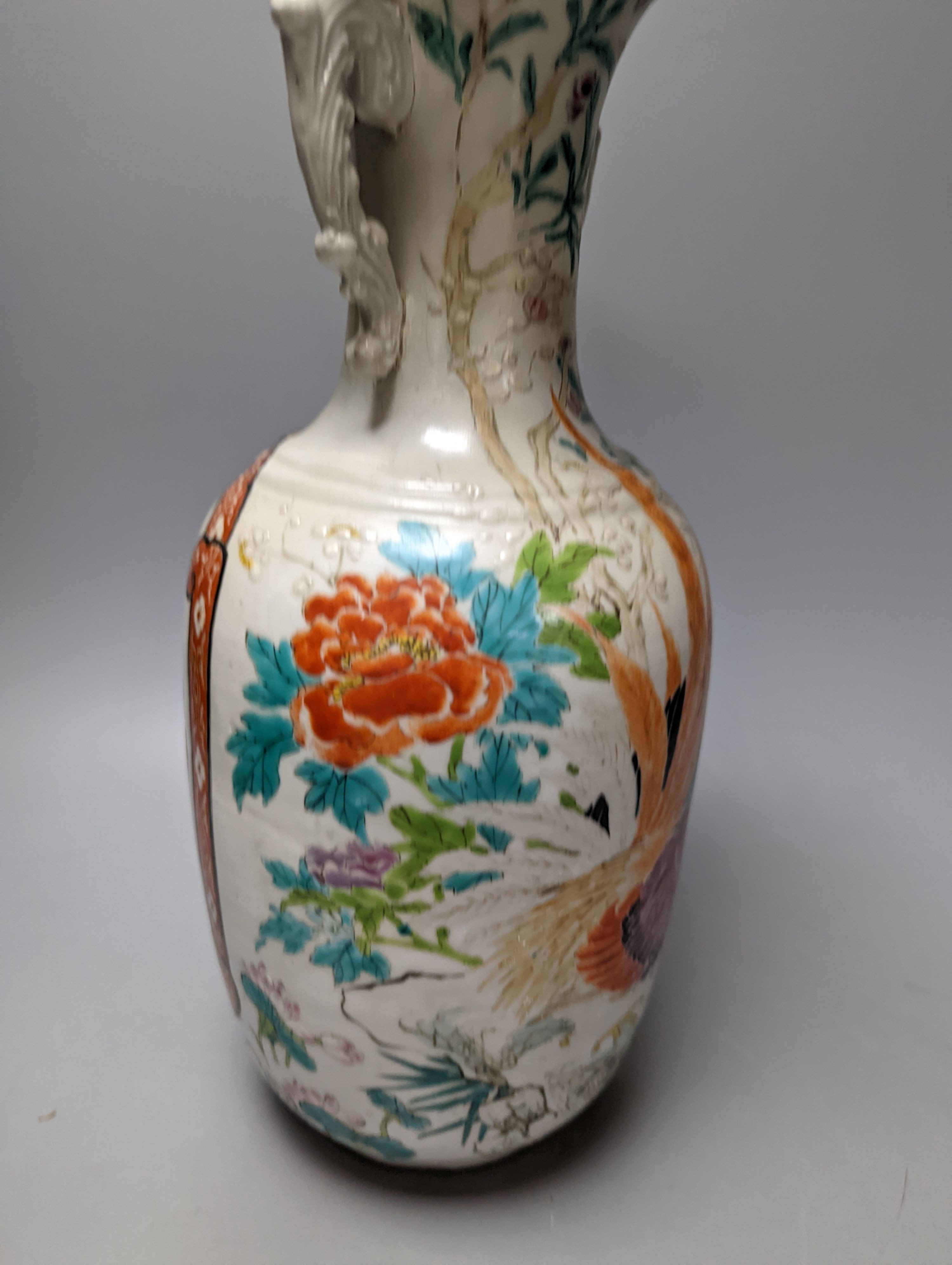 A Chinese famille rose vase and two ginger jars, together with a Japanese vase, 38cm